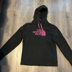 Black north face hoodie with pink detail. Size medium.